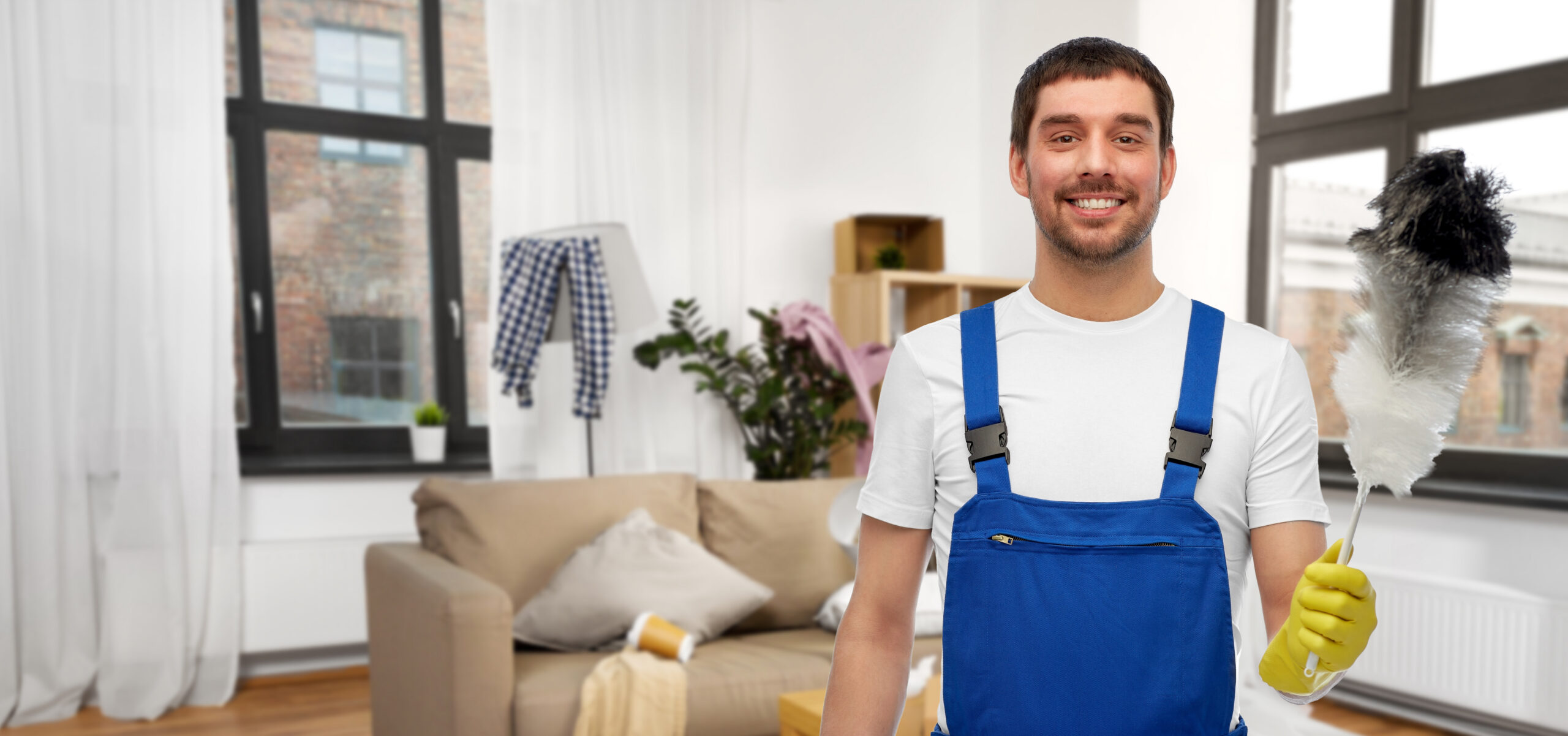 Professional male cleaner with duster home cleaning Nagpur